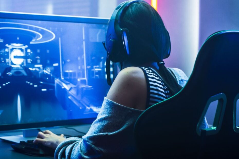 A PC gamer in a racing-style gaming chair