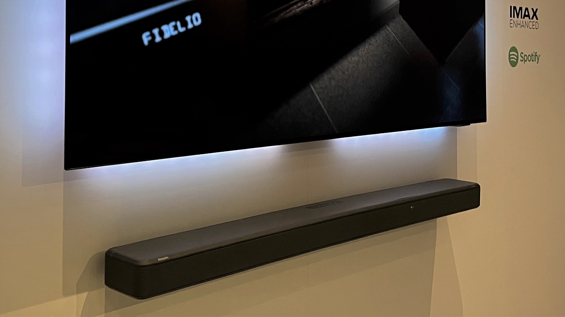Philips Fidelio FB1 soundbar with Ambilight TV on wall