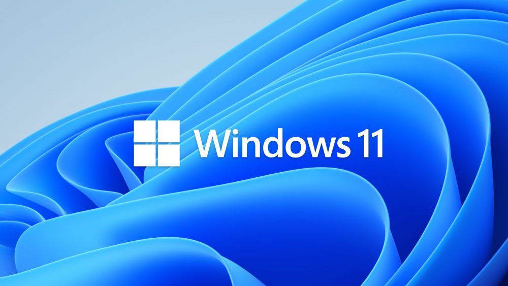 Windows 11 logo in front of the default wallpaper
