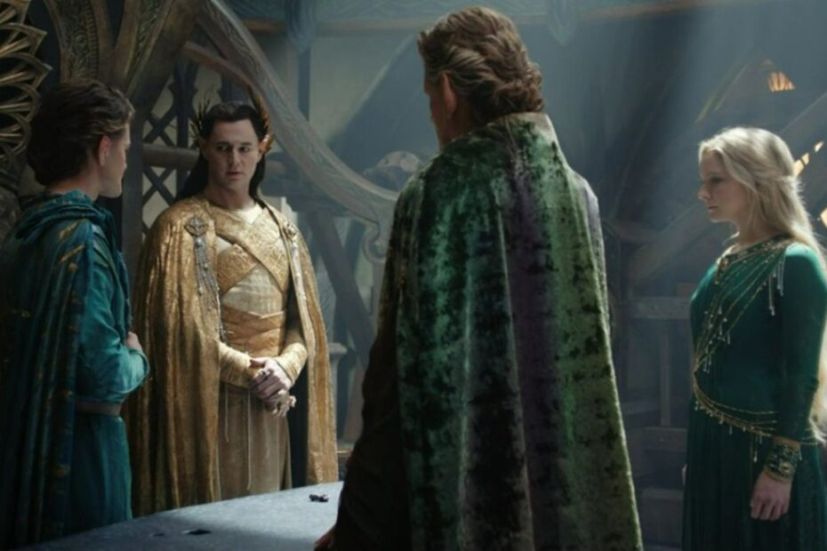 Gil-galad, Elrond, Celebrimbor, and Galadriel stand around a table with the piece of mithril resting on it in The Rings of Power episode 8