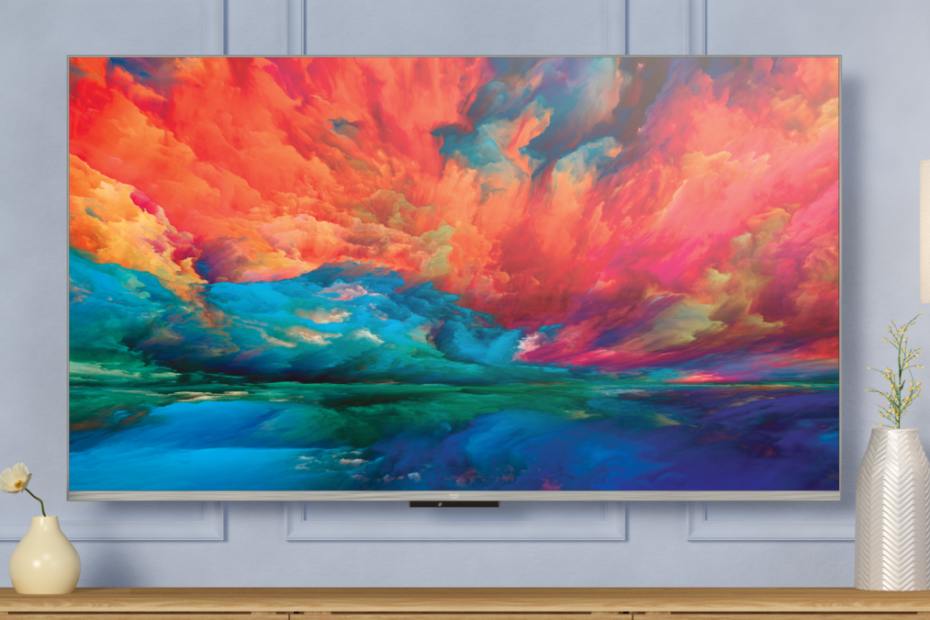 Fire TV Omni QLED on wall showing art