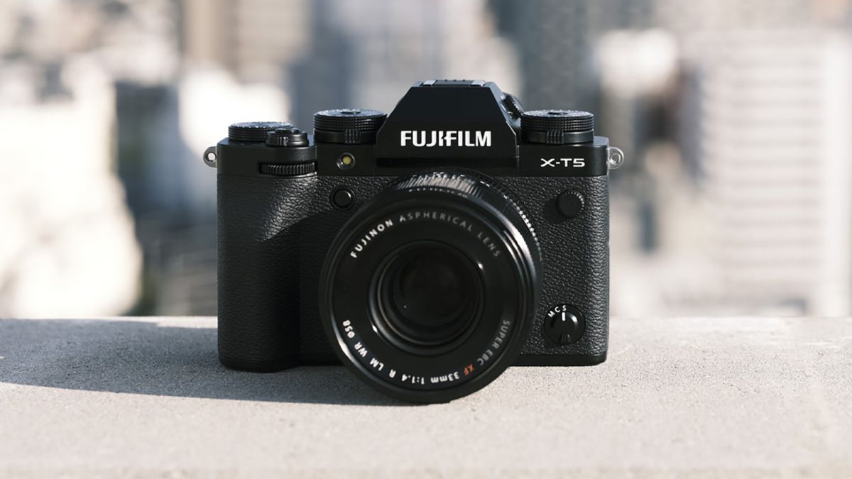 The Fujifilm X-T5 camera sitting on a wall