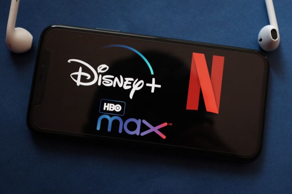 Disney Plus, Netflix and HBO Max logos on an iPhone screen