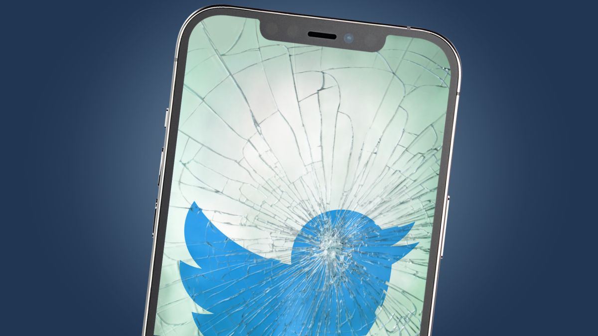A broken phone screen showing the Twitter logo
